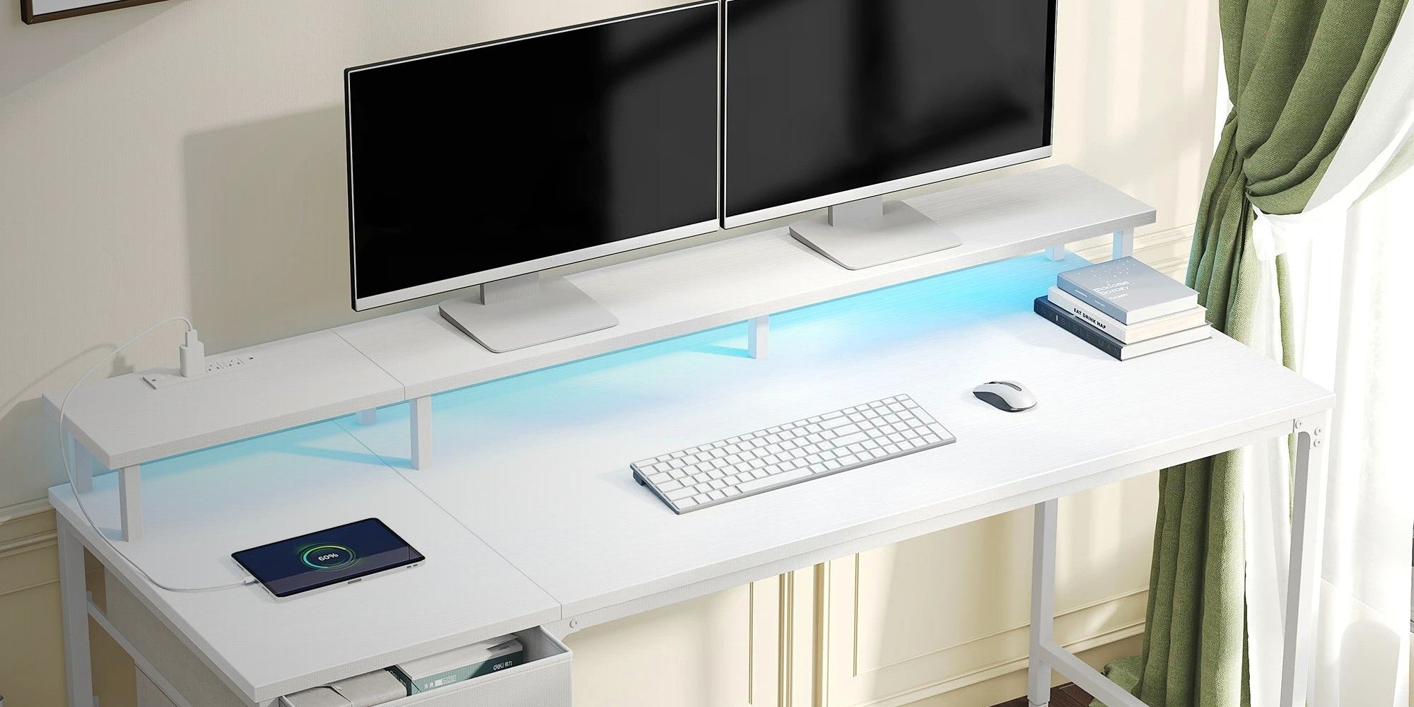 A white powered desk with dual monitors on its shelf, LED underglow and fabric storage drawers