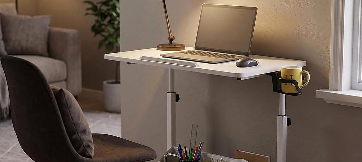 A height-adjustable rolling desk in a warm living room